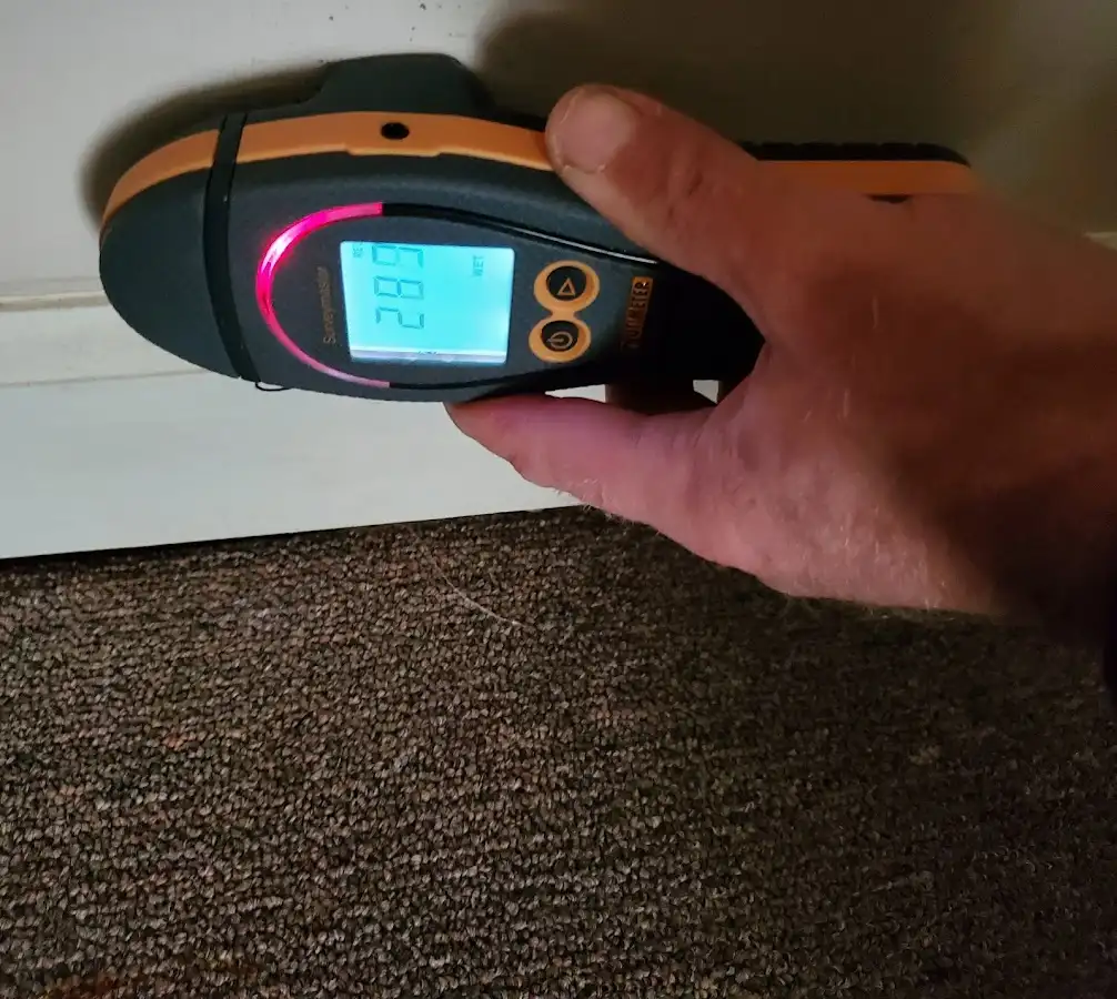 Moisture detection at baseboard during Storm Damage Restoration in Amherst